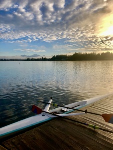 North Cascades Crew rowing shell at the dock on Lake Stevens