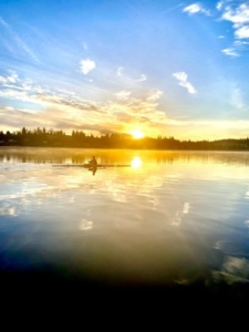 North Cascades Crew rower on lake Stevens during sunrise